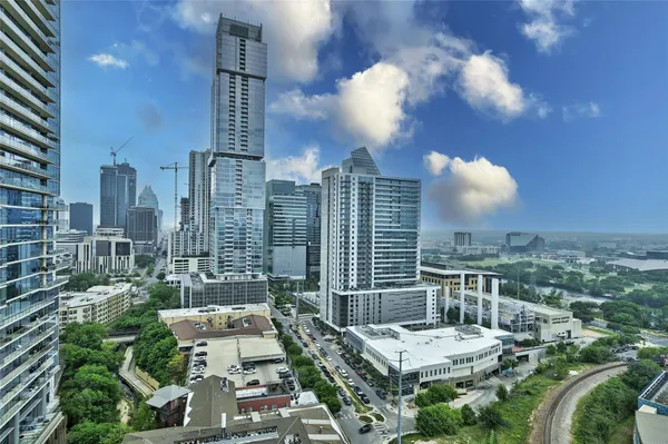 a view of city with tall buildings