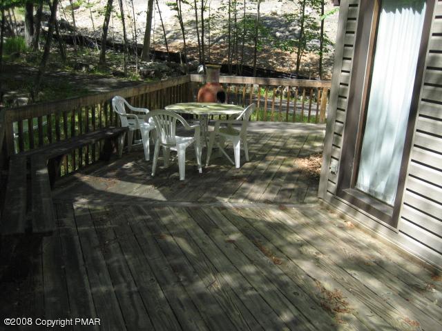 1071 Canterbury Road Bushkill, PA 18324 - Photo 6 of 6 a view of a balcony with table and chairs
