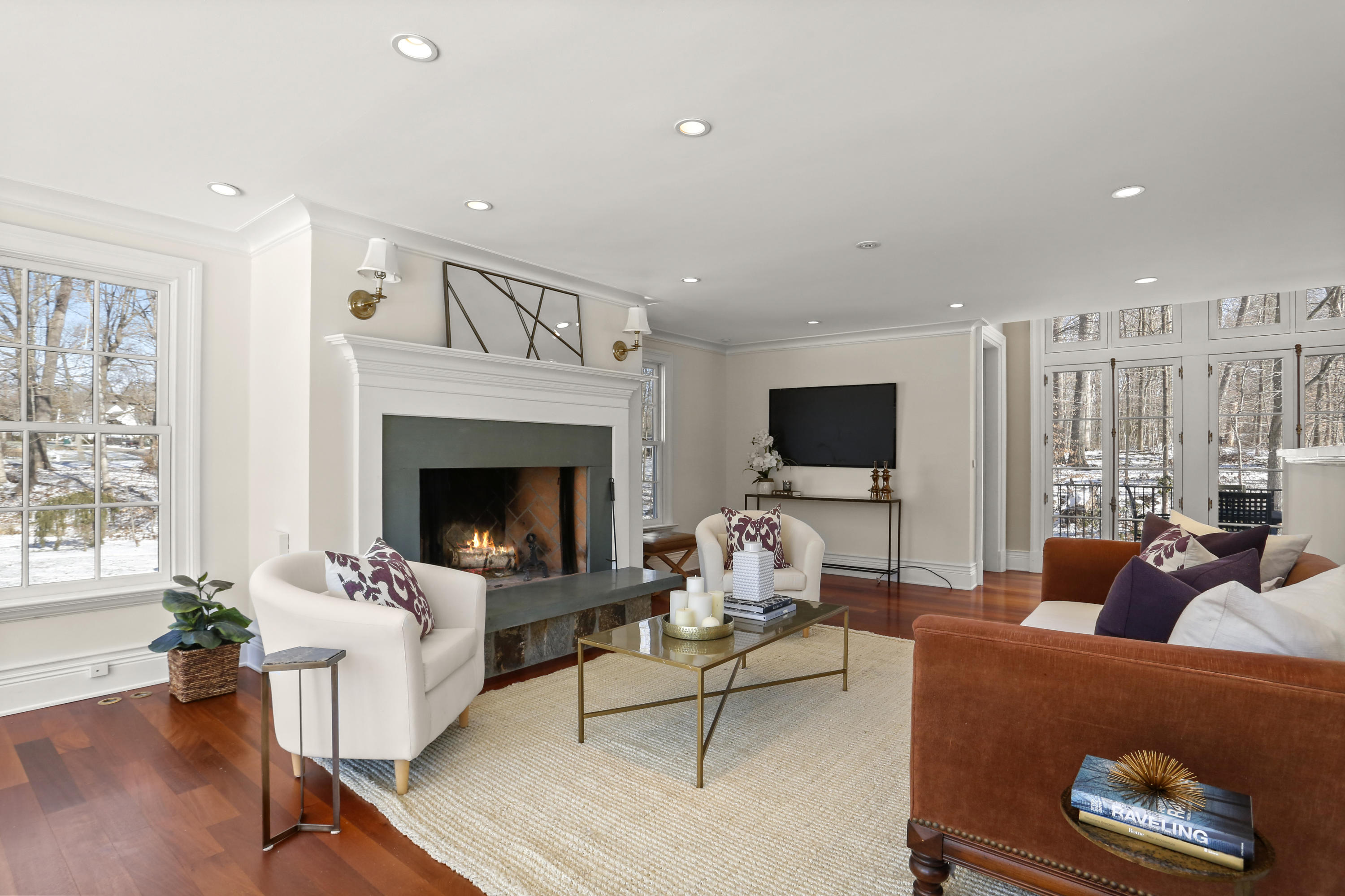89 Dabney Road New Canaan, CT 06840 - Photo 13 of 40 a living room with furniture a fireplace and a flat screen tv