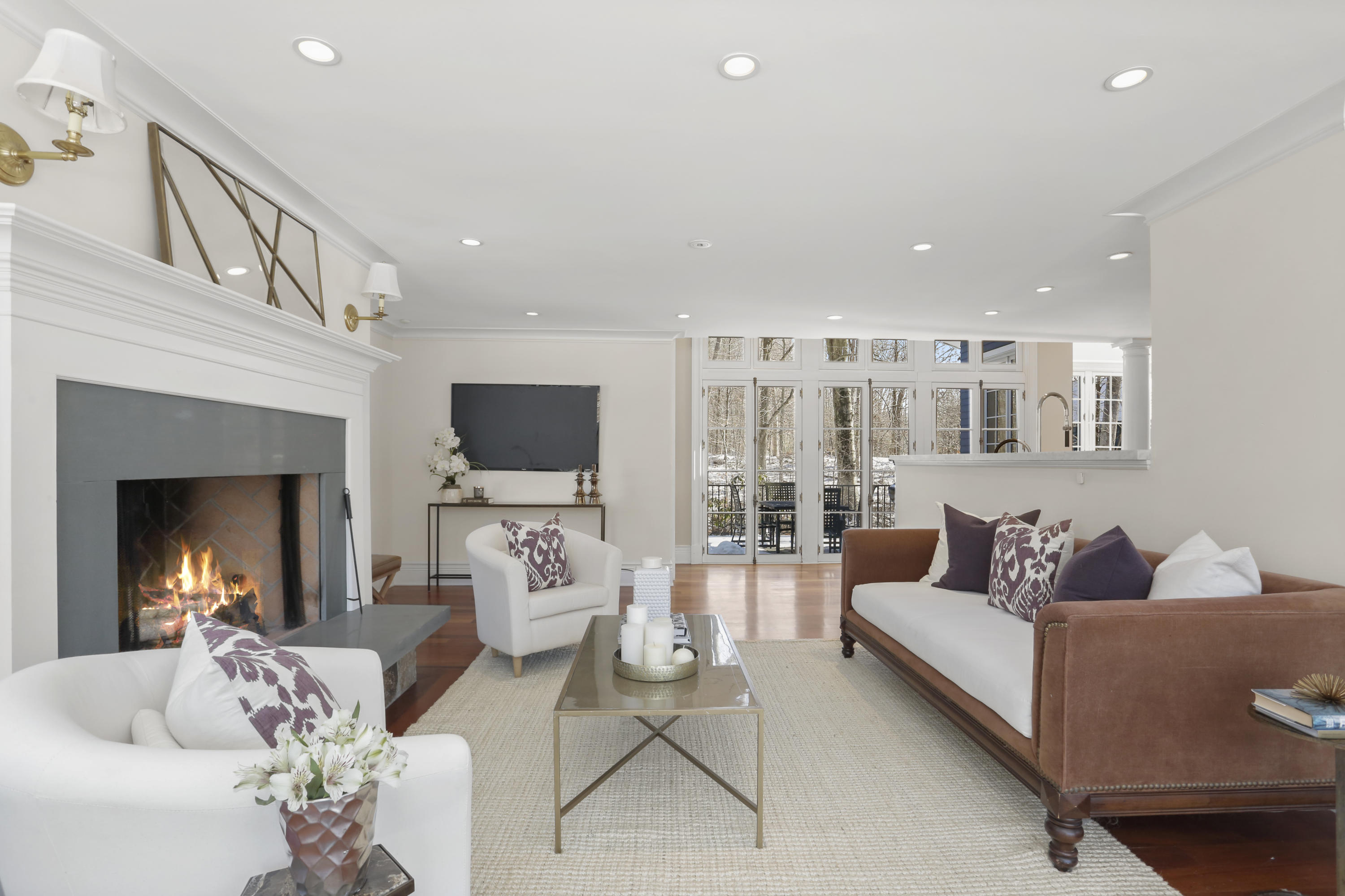 89 Dabney Road New Canaan, CT 06840 - Photo 14 of 40 a living room with furniture fireplace and a flat screen tv