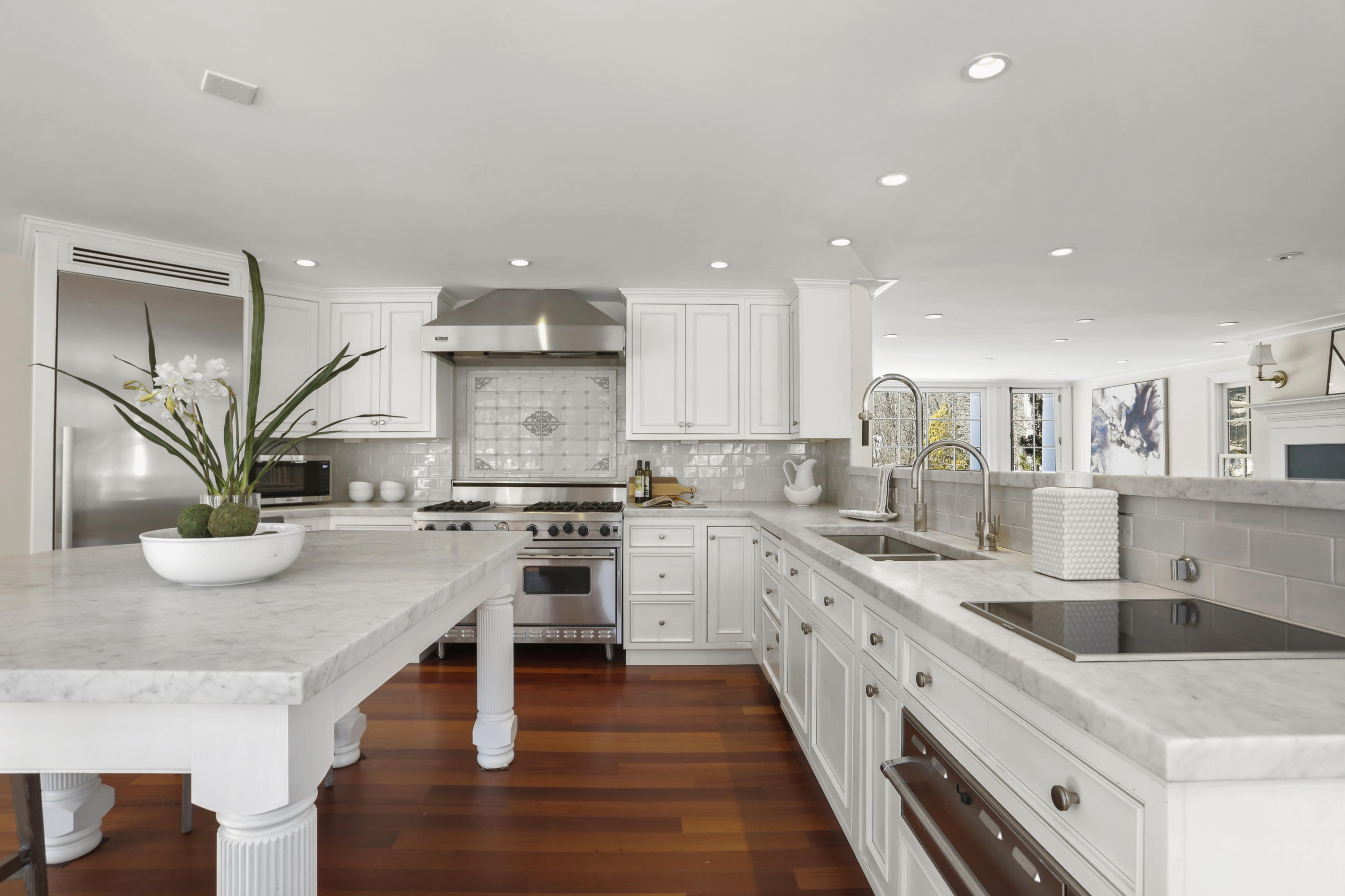 89 Dabney Road New Canaan, CT 06840 - Photo 17 of 40 a kitchen with white cabinets and appliances