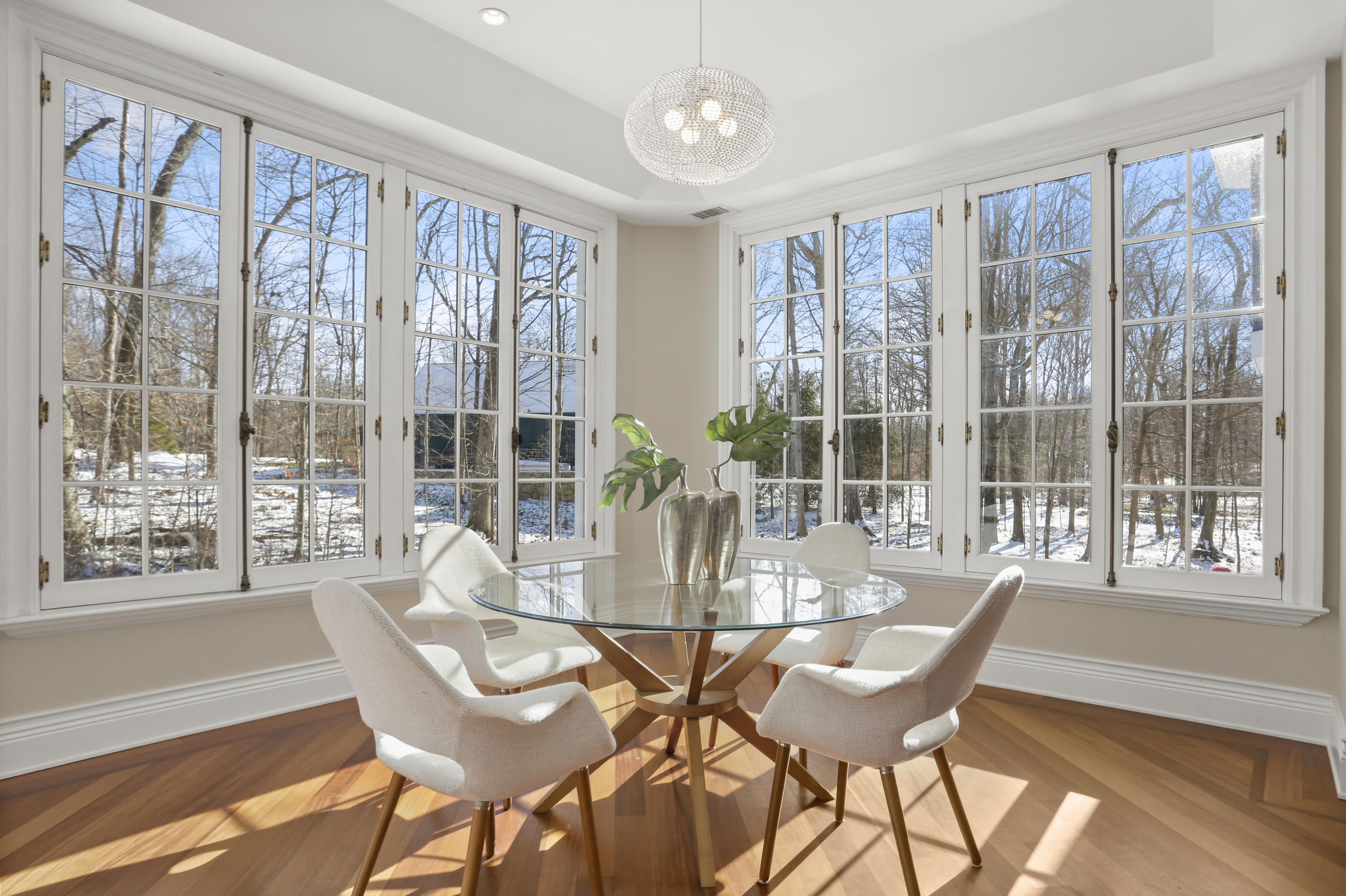 89 Dabney Road New Canaan, CT 06840 - Photo 20 of 40 a view of a dining room with furniture large windows and wooden floor