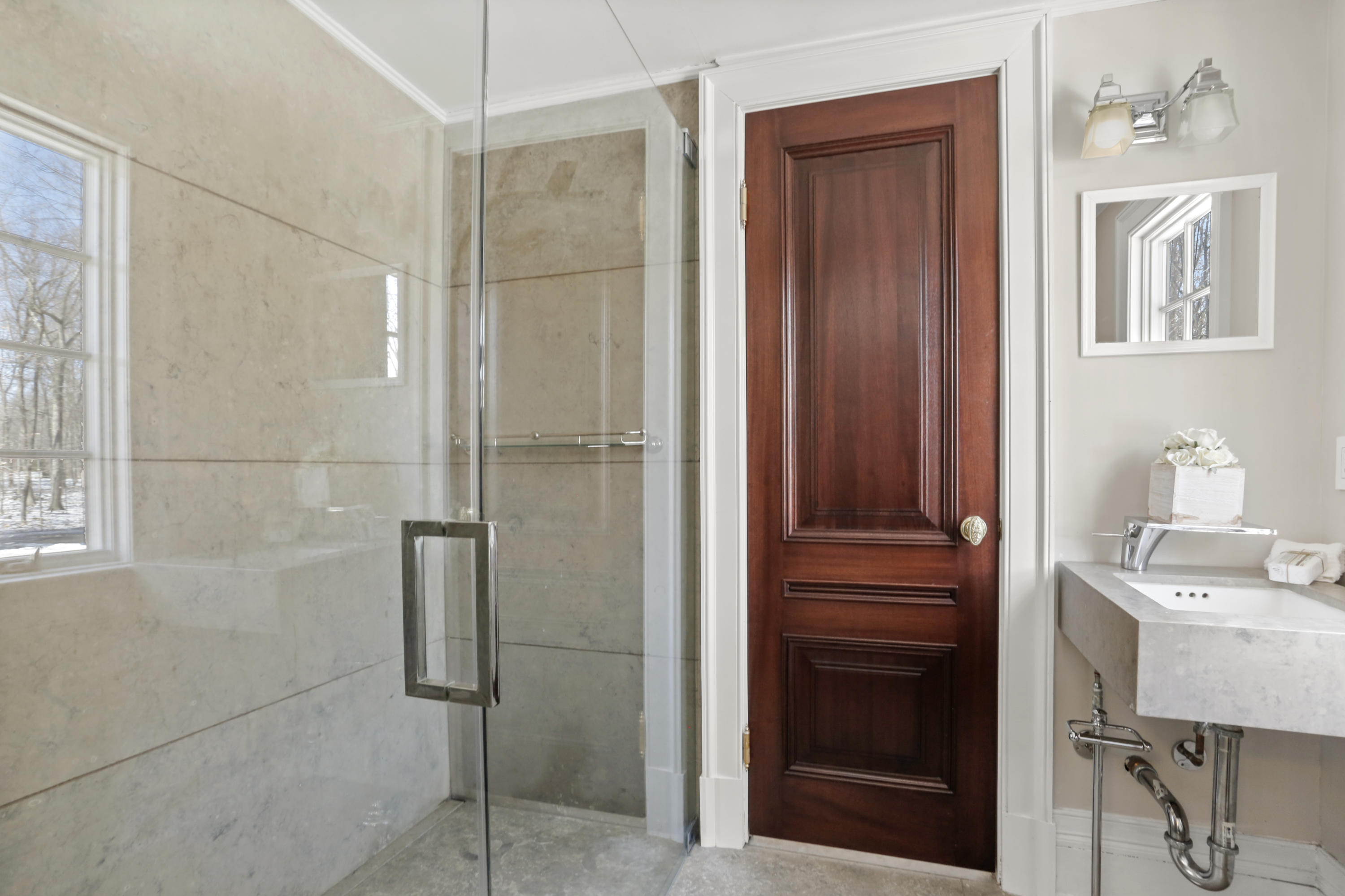 89 Dabney Road New Canaan, CT 06840 - Photo 30 of 40 a bathroom with a sink a mirror and shower