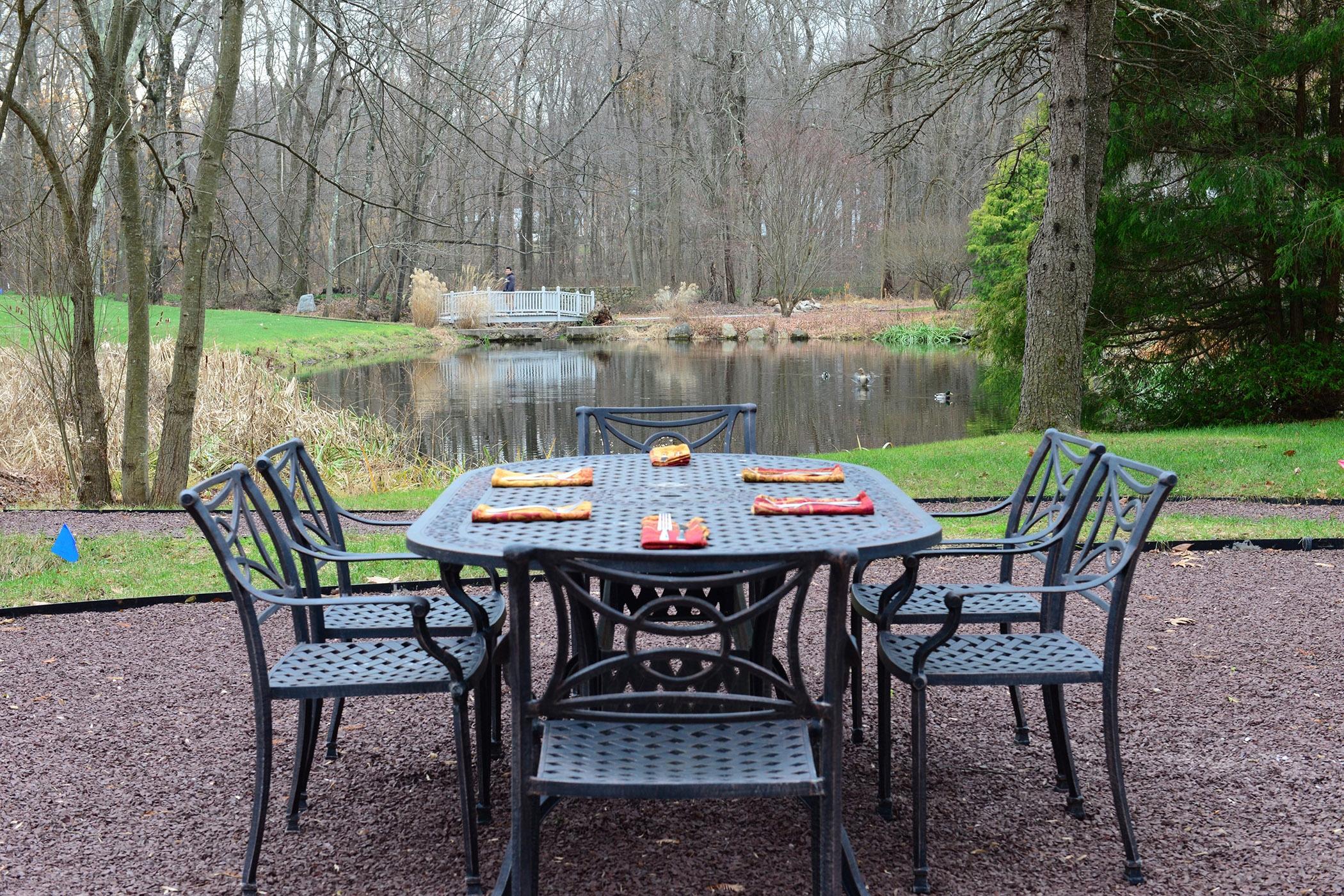 89 Dabney Road New Canaan, CT 06840 - Photo 36 of 40 a table and chairs in the patio