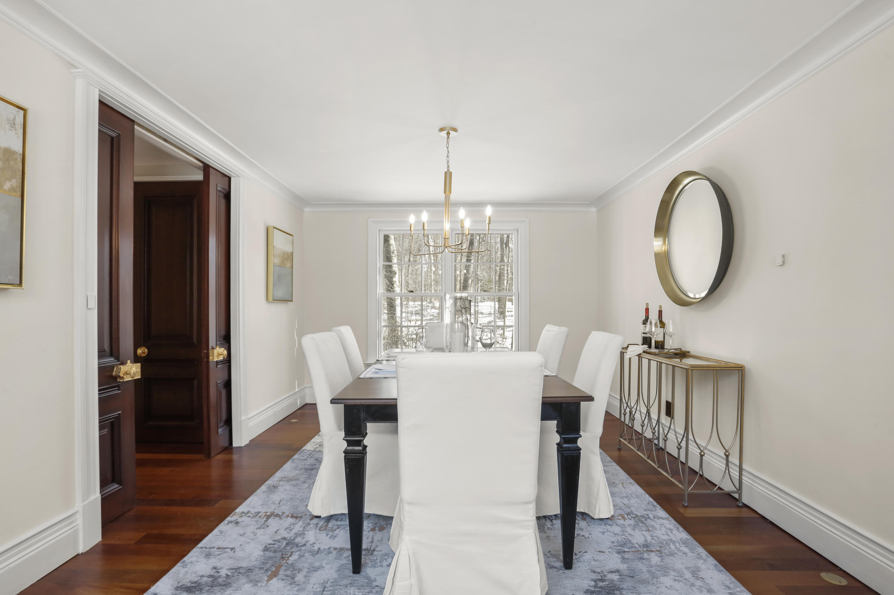 89 Dabney Road New Canaan, CT 06840 - Photo 9 of 40 a dining room with furniture a chandelier and wooden floor
