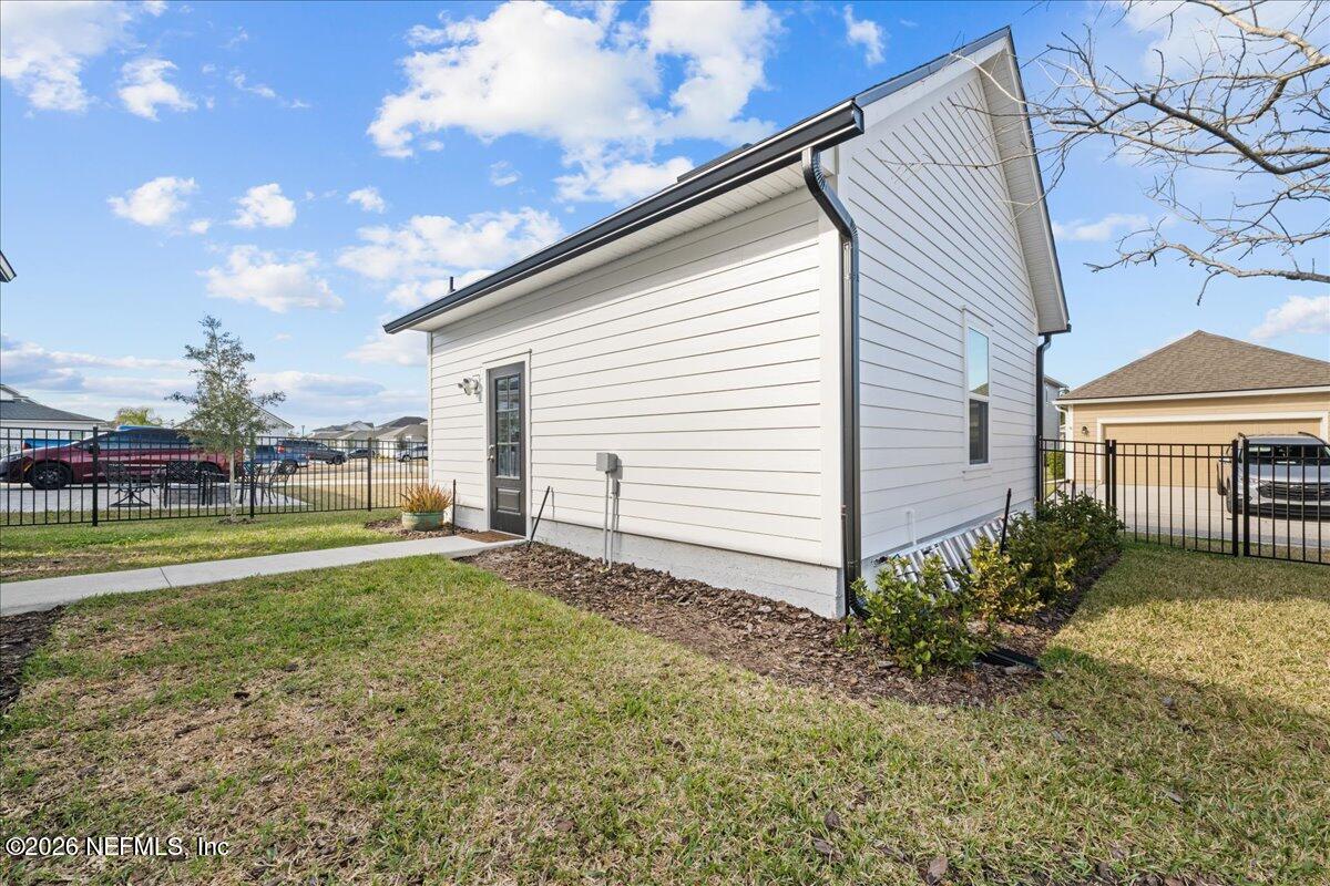 92 Patina Place St. Augustine, FL 32092 - Photo 24 of 26 a view of a house with a yard