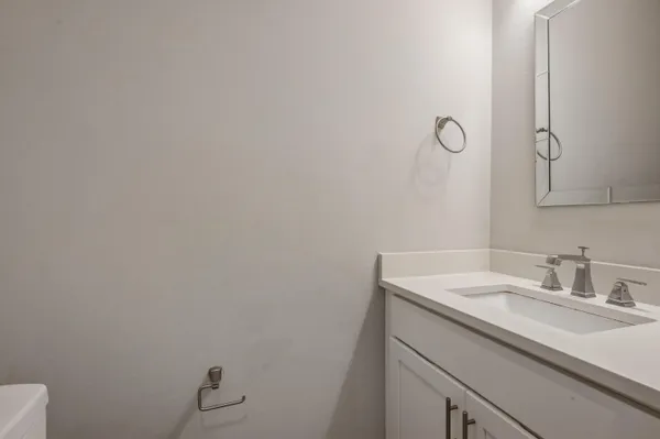 a bathroom with a sink and vanity