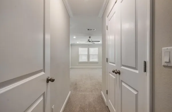 a view of bathroom with a sink and mirror