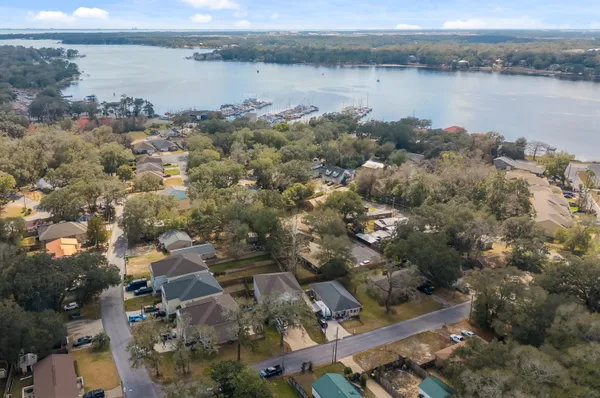 an aerial view of a house with a lake view