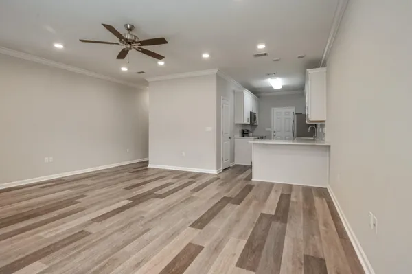 a view of a kitchen with a sink and cabinet