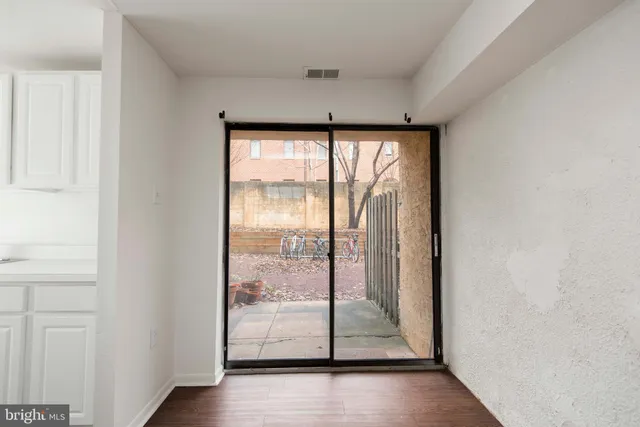 a view of an entryway with wooden floor