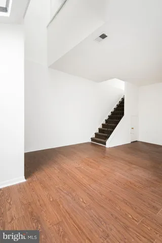 a view of an empty room with stairs