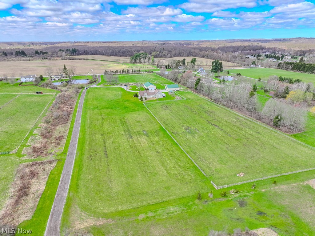 18919 Ravenna Road Chagrin Falls, OH 44023 - Photo 46 of 48 Drone view of the property looking west. Greenspace/hay field on the left and fenced pasture on the right
