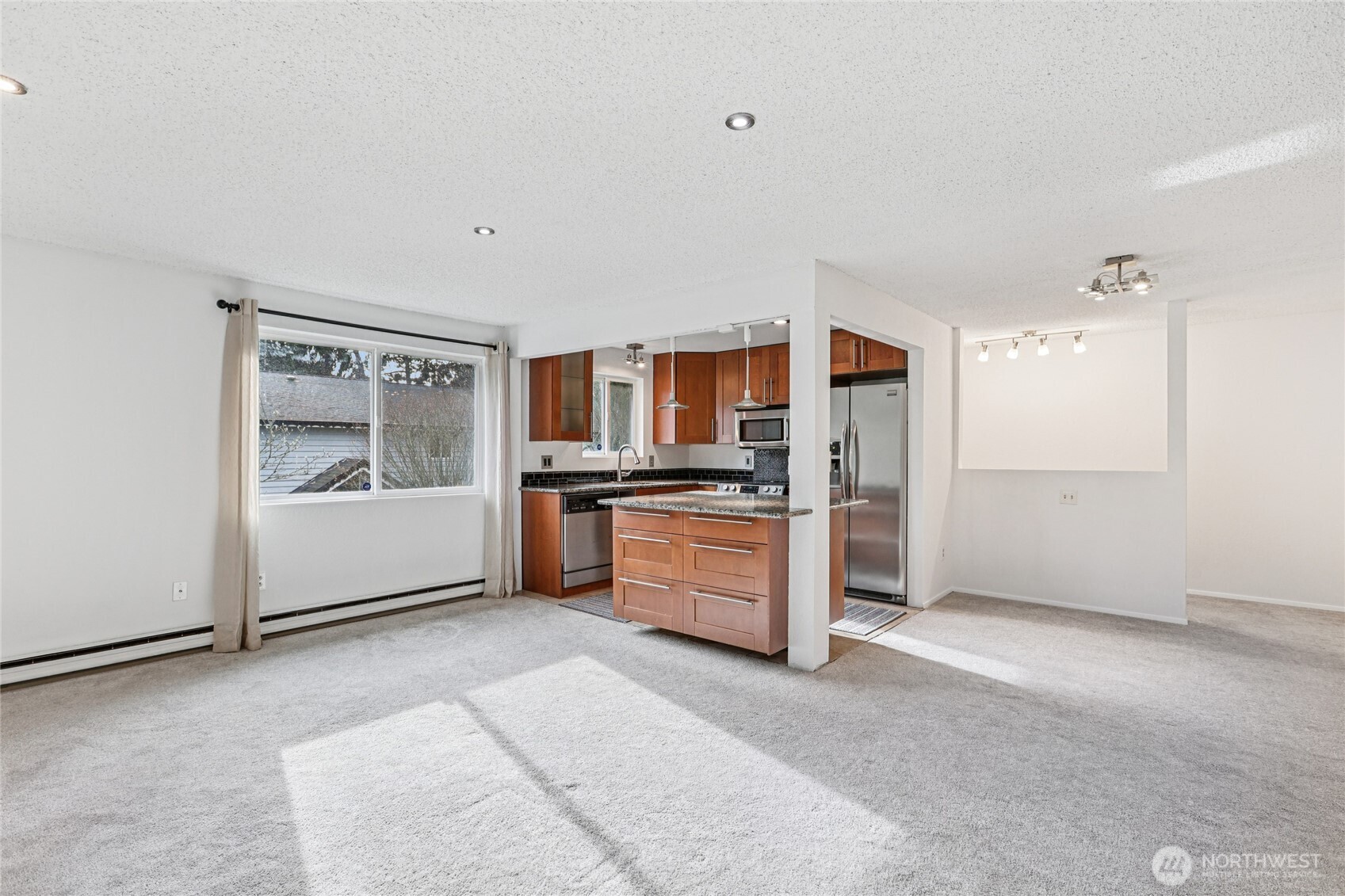7909 218th Street Southwest, Unit 4 Edmonds, WA 98026 - Photo 5 of 29 a view of kitchen with refrigerator and microwave