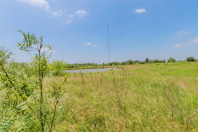 a view of a lake with a big yard