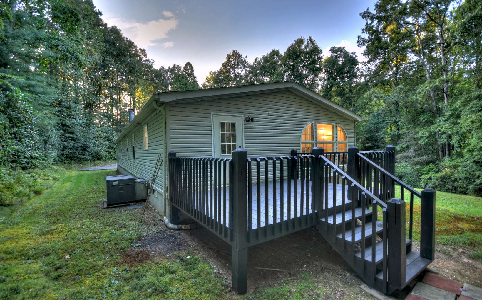 132 Rolling Oaks Road Murphy, NC 28906 - Photo 7 of 34 a view of a house with a yard and a deck