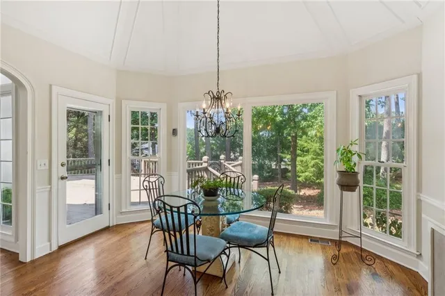 a view of a dining room with furniture window and wooden floor