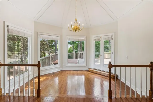 a view of swimming pool with wooden floor