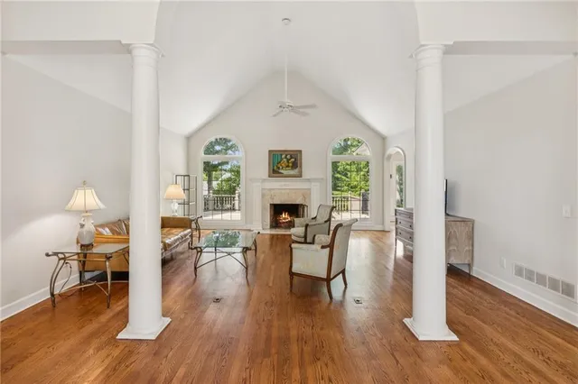 a living room with furniture and a fireplace