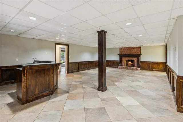 a view of an empty room with a fireplace