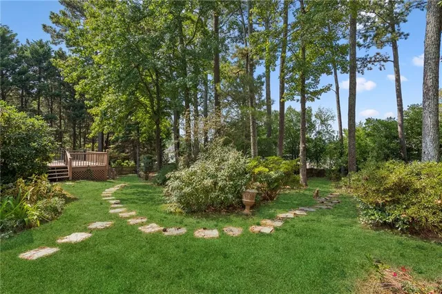 a green field with lots of trees