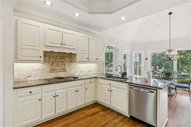 a kitchen with sink and cabinets