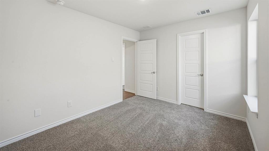 419 Epiphany Lane Lavon, TX 75166 - Photo 28 of 31 Carpeted interior room with white walls, white trim, and a window ledge