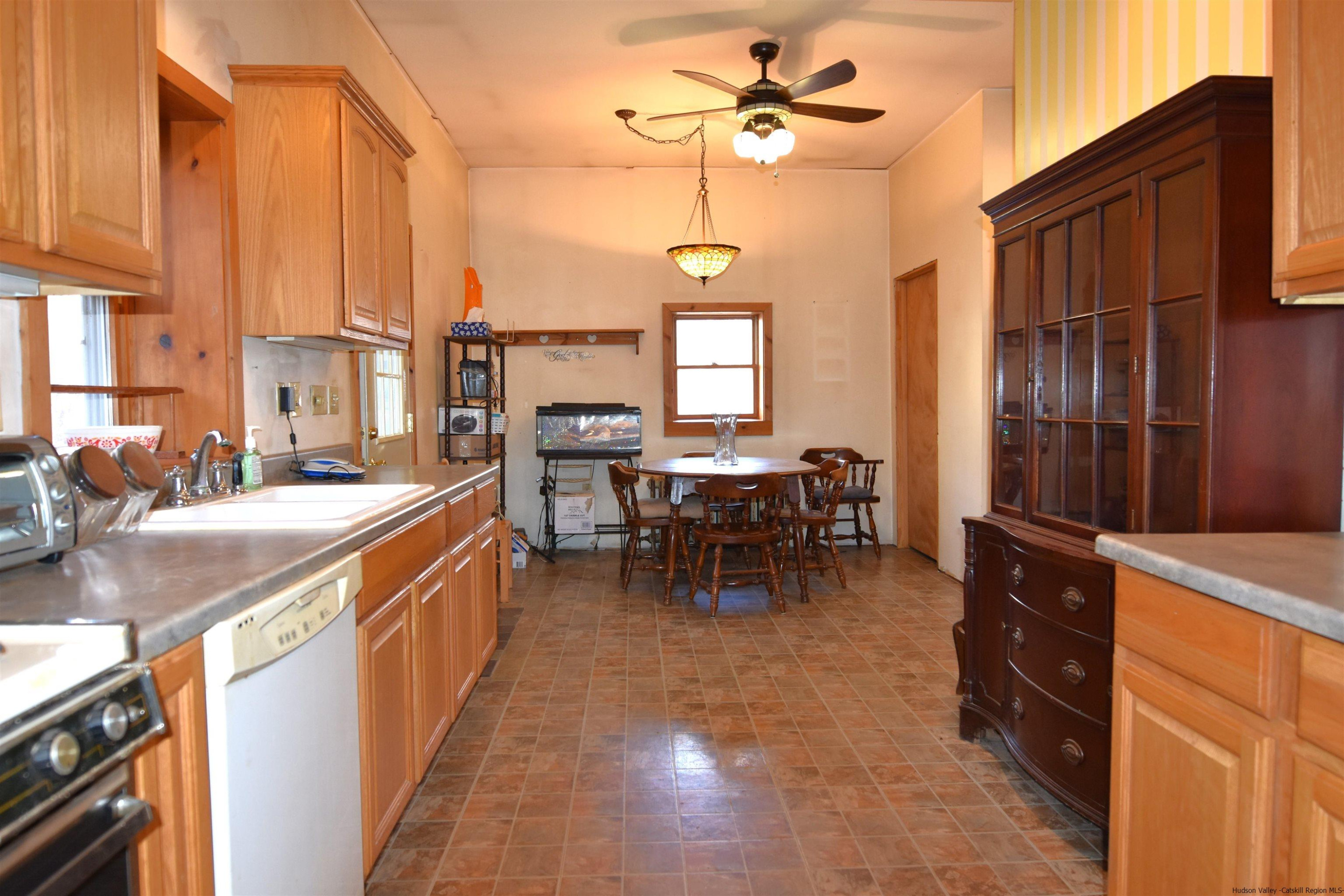 97 Blacks Road Kingston, NY 12401 - Photo 3 of 21 a view of a kitchen with kitchen island granite countertop a sink a counter top space and appliances