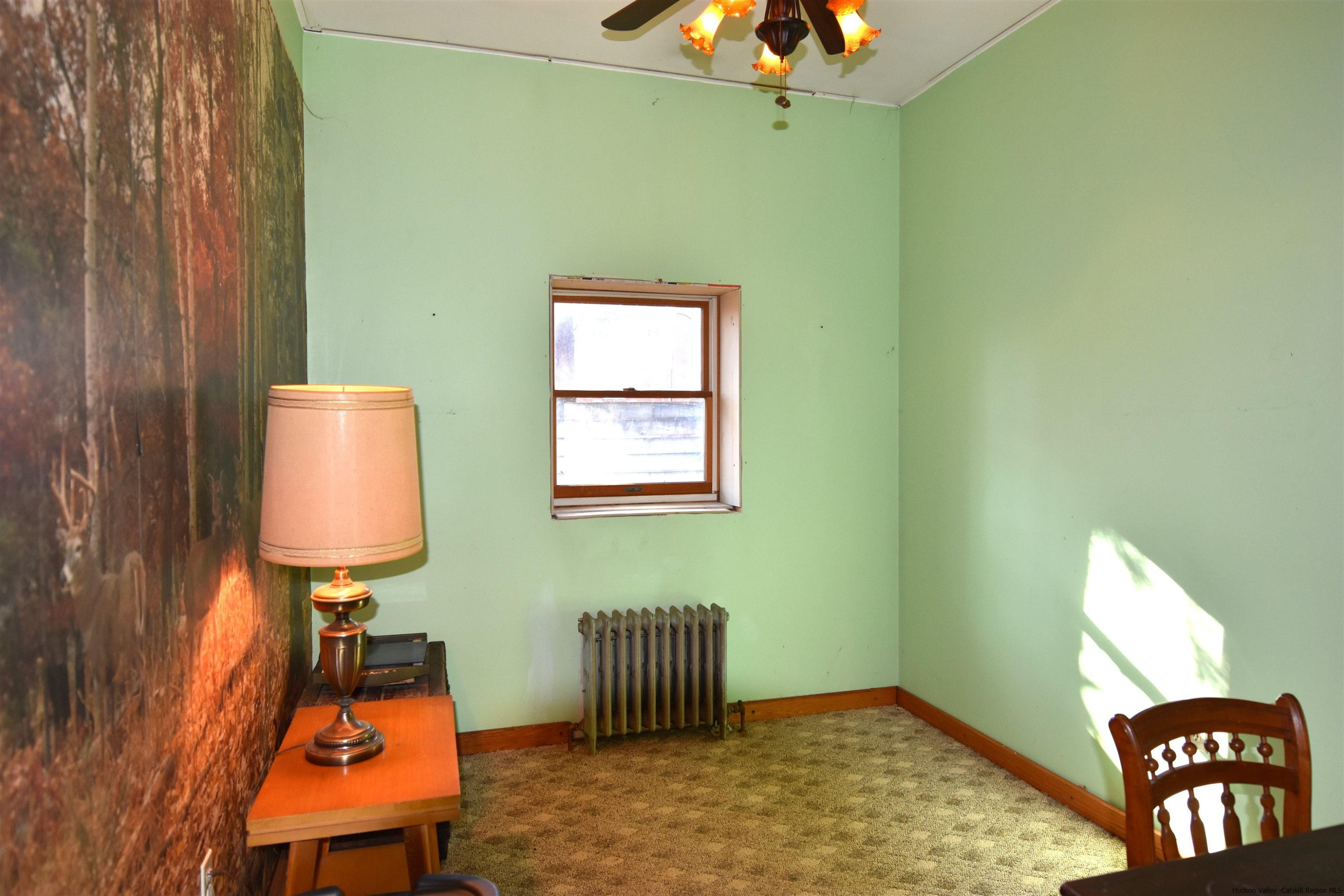 97 Blacks Road Kingston, NY 12401 - Photo 6 of 21 a room with furniture and window