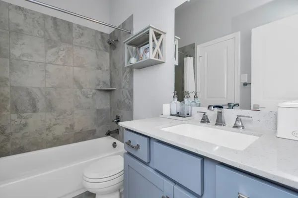 a bathroom with a sink a toilet and a bathtub