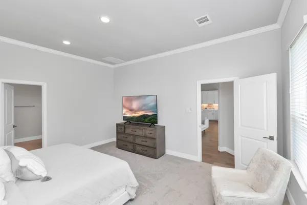 a bedroom with a bed and furniture