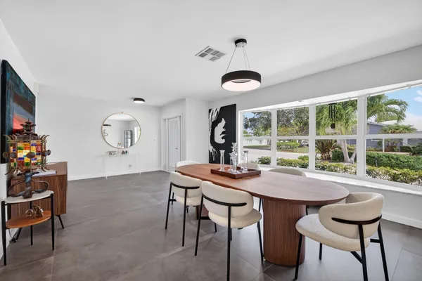 a kitchen with a sink and white cabinets
