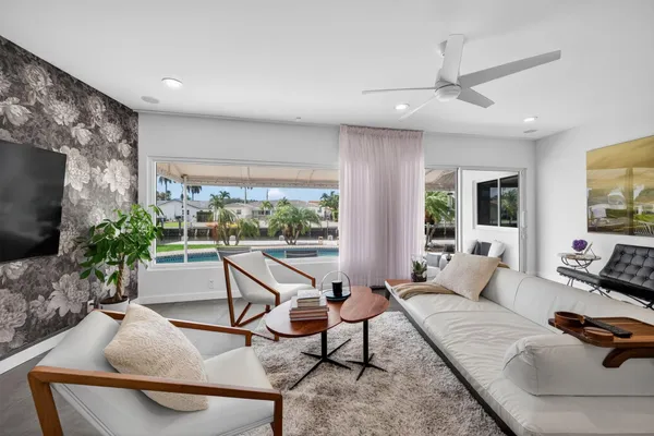 a living room with furniture and a window