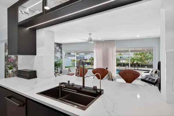 a kitchen with a sink and a large window