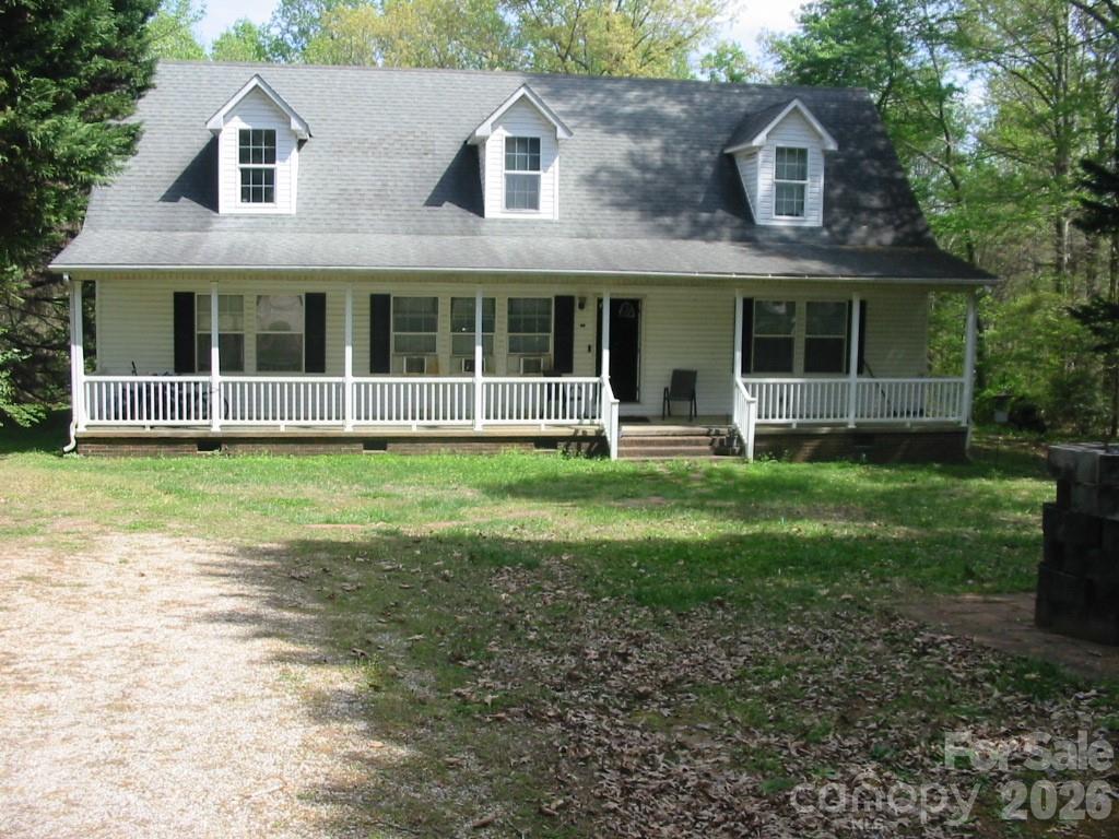 213 Vicki Way Stanley, NC 28164 - Photo 1 of 19 a view of a brick house with yard and large trees