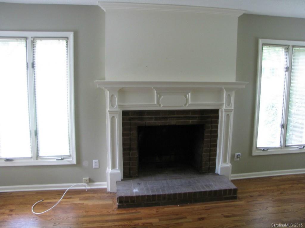 6133 Williams Road Charlotte, NC 28215 - Photo 5 of 14 a living room with a fireplace