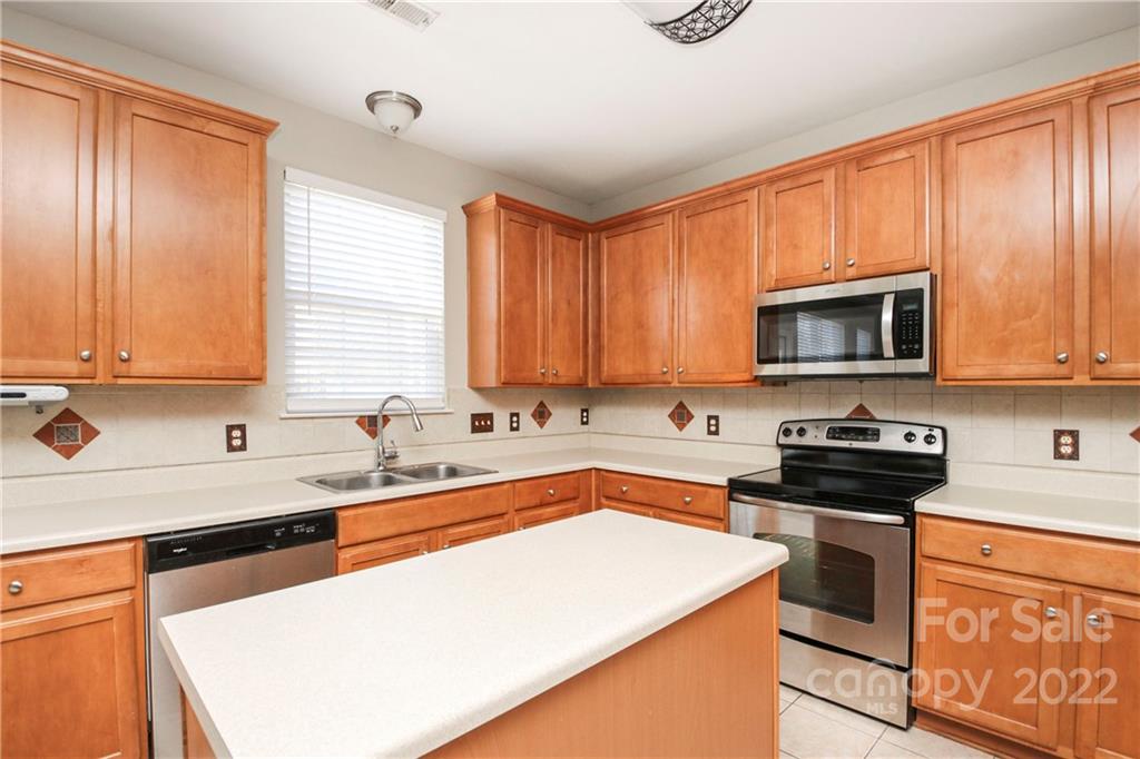 1807 Montague Road, Unit 254 Clover, SC 29710 - Photo 11 of 48 a kitchen with stainless steel appliances a stove sink microwave and cabinets