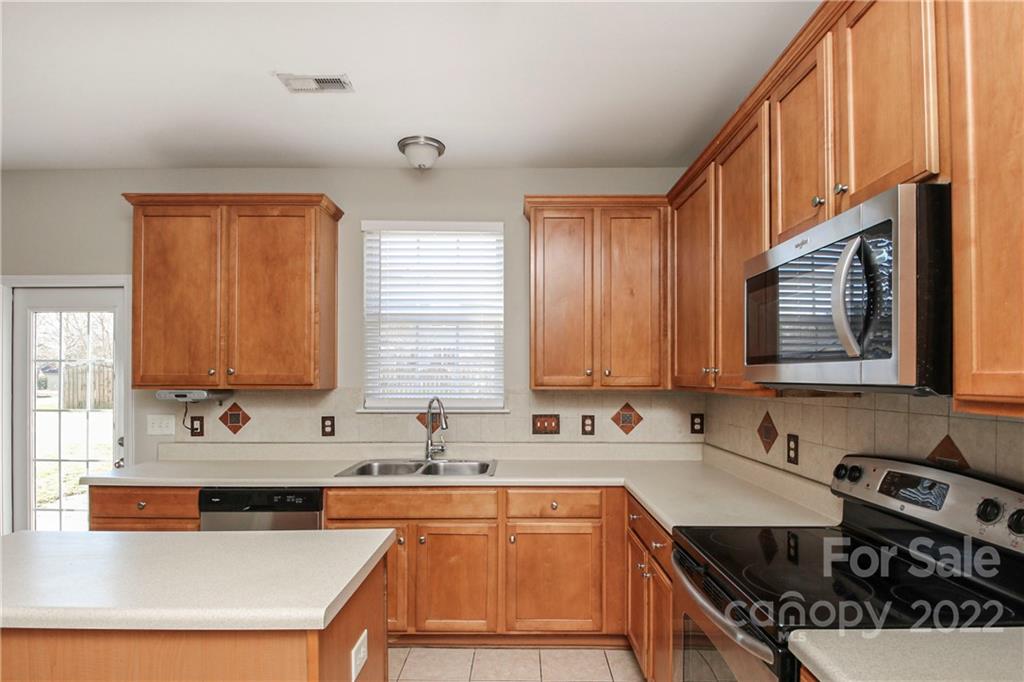 1807 Montague Road, Unit 254 Clover, SC 29710 - Photo 12 of 48 a kitchen with stainless steel appliances a sink stove and cabinets
