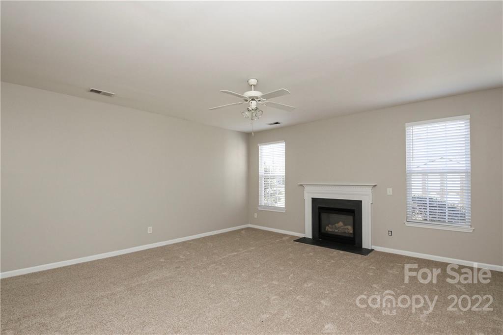 1807 Montague Road, Unit 254 Clover, SC 29710 - Photo 14 of 48 an empty room with a fireplace and a window