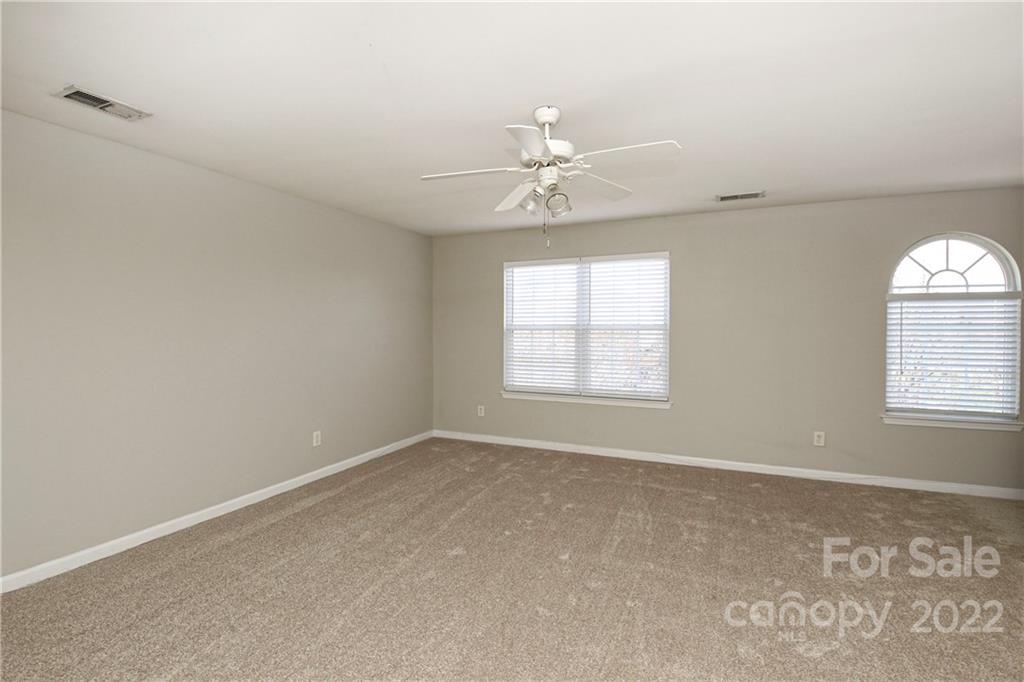 1807 Montague Road, Unit 254 Clover, SC 29710 - Photo 20 of 48 an empty room with windows and ceiling fan