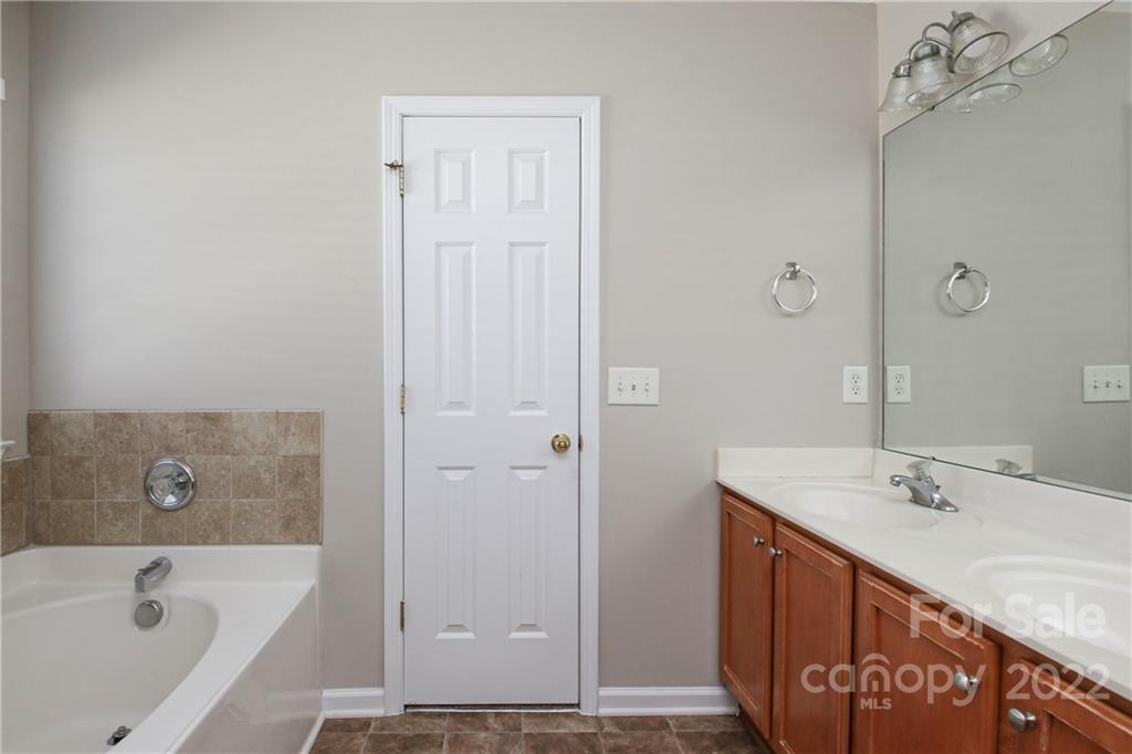 1807 Montague Road, Unit 254 Clover, SC 29710 - Photo 25 of 48 a bathroom with a tub sink and vanity
