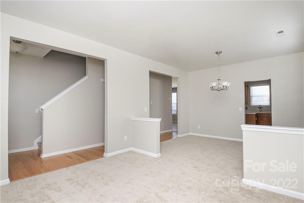 1807 Montague Road, Unit 254 Clover, SC 29710 - Photo 7 of 48 a view of an empty room with window and wooden floor