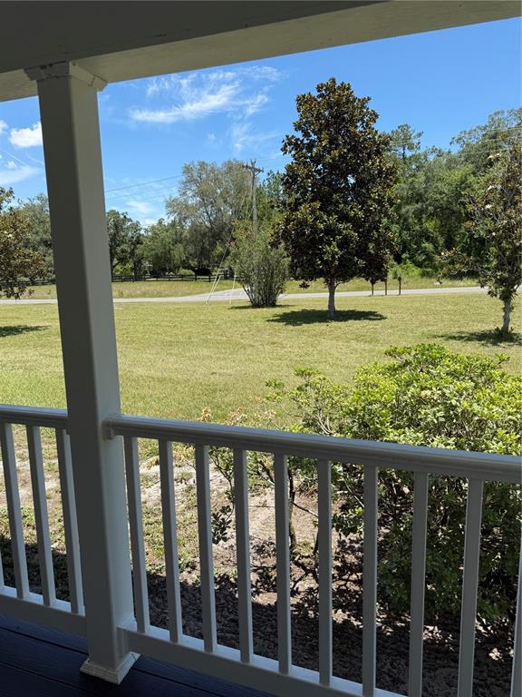 7390 South Mc Alpin Road McAlpin, FL 32062 - Photo 27 of 53 a view of a yard with wooden fence
