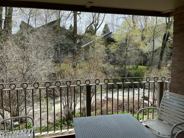 a balcony with wooden floor