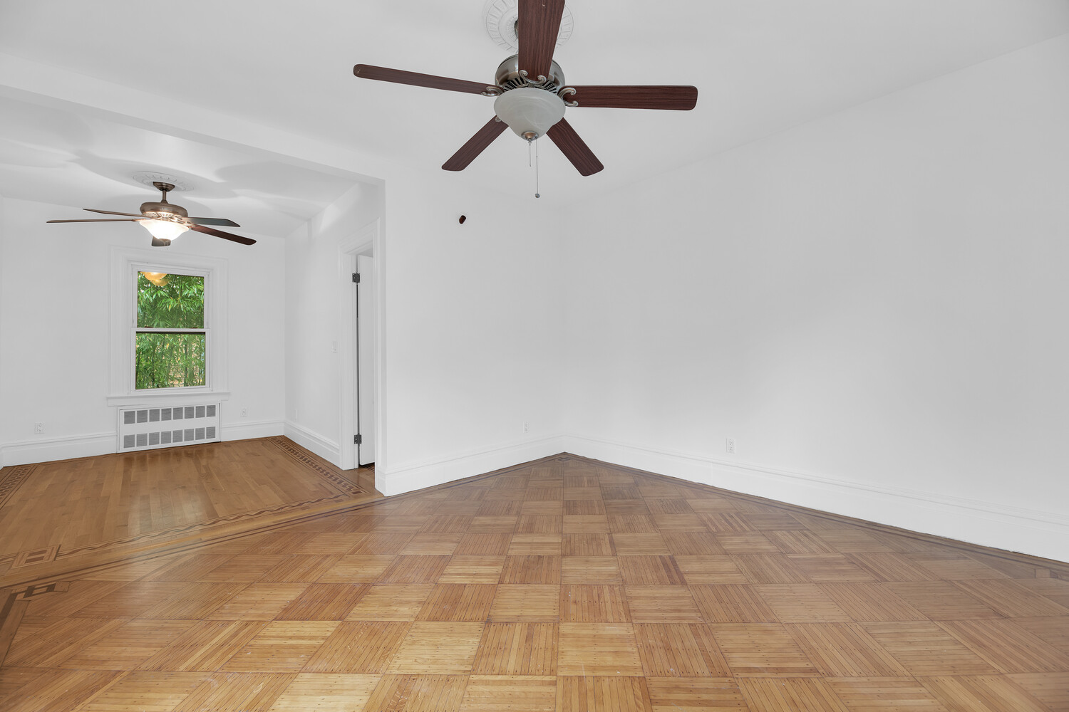 242 Stratford Road Brooklyn, NY 11218 - Photo 10 of 27 a view of an empty room with a window