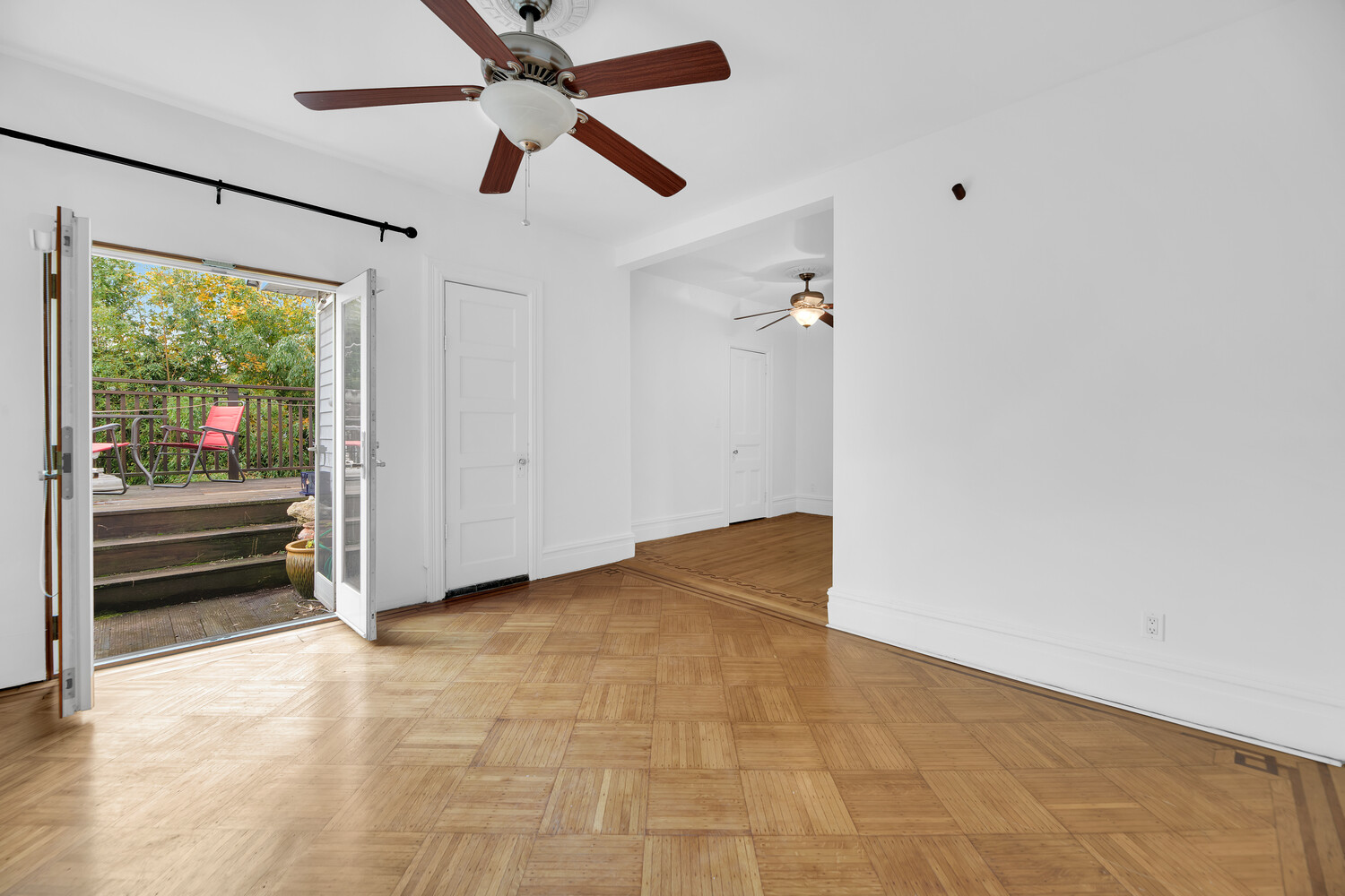 242 Stratford Road Brooklyn, NY 11218 - Photo 13 of 27 an empty room with ceiling fan and window