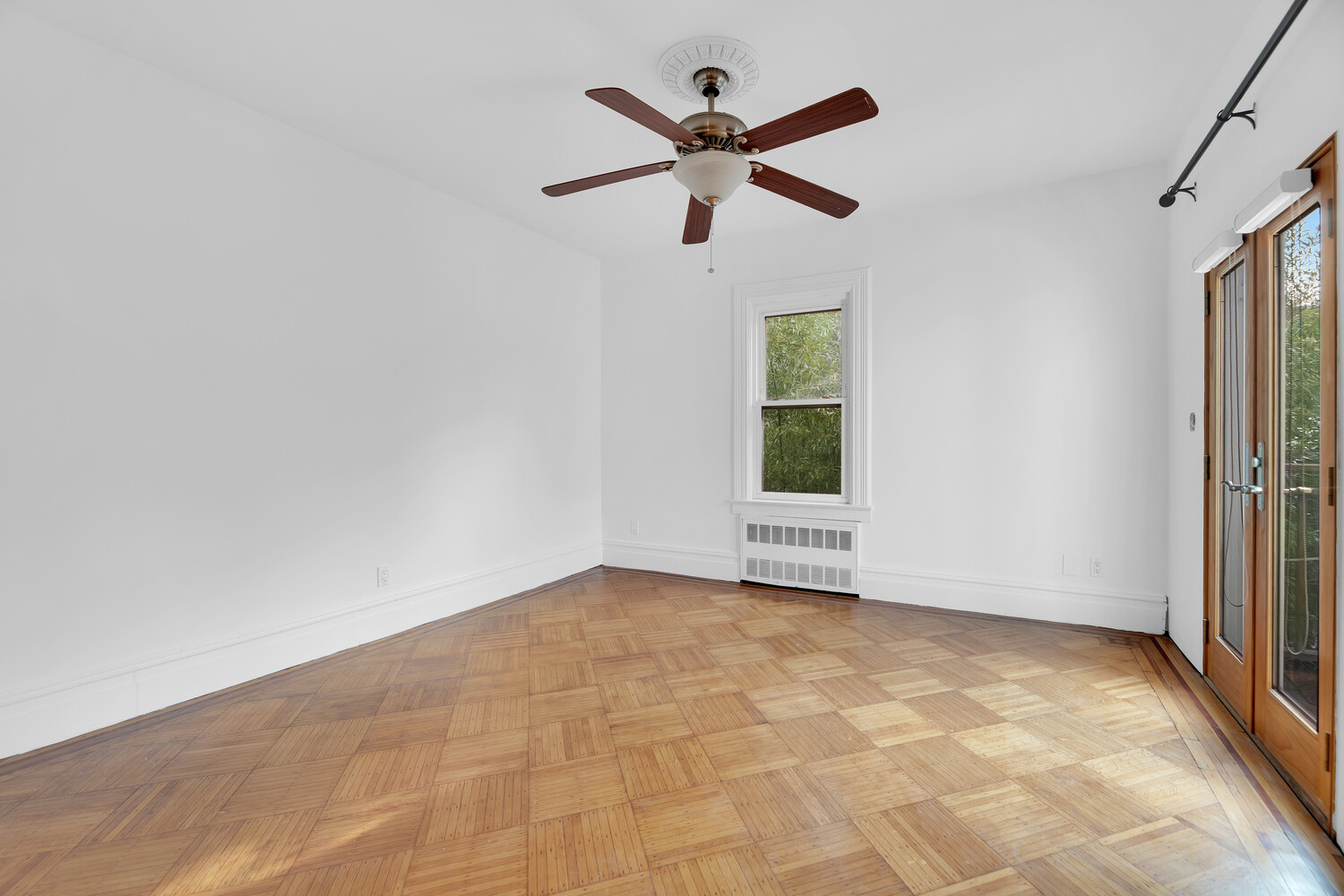 242 Stratford Road Brooklyn, NY 11218 - Photo 14 of 27 a view of a livingroom with a ceiling fan and window