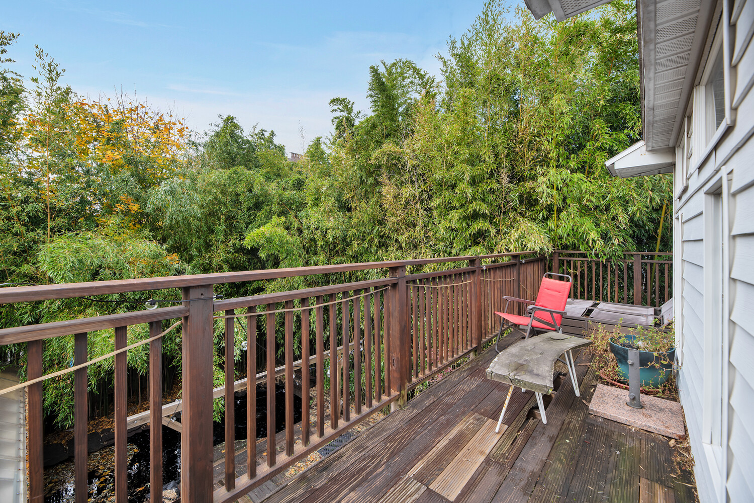 242 Stratford Road Brooklyn, NY 11218 - Photo 15 of 27 a balcony with wooden floor and outdoor seating
