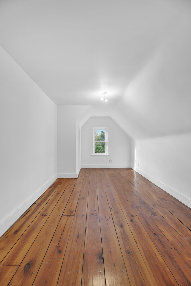 242 Stratford Road Brooklyn, NY 11218 - Photo 21 of 27 a view of empty room with wooden floor