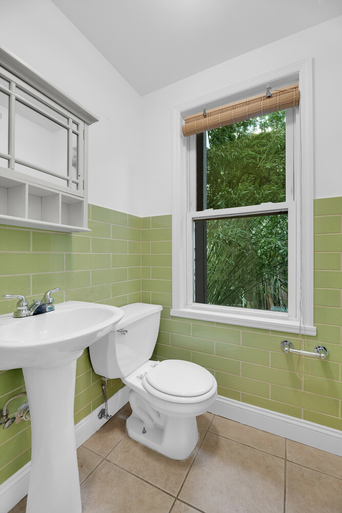 242 Stratford Road Brooklyn, NY 11218 - Photo 25 of 27 a bathroom with a sink toilet and mirror